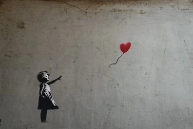Banksy's iconic “Girl With Balloon” artwork featuring a red heart-shaped balloon at Moco Museum Barcelona